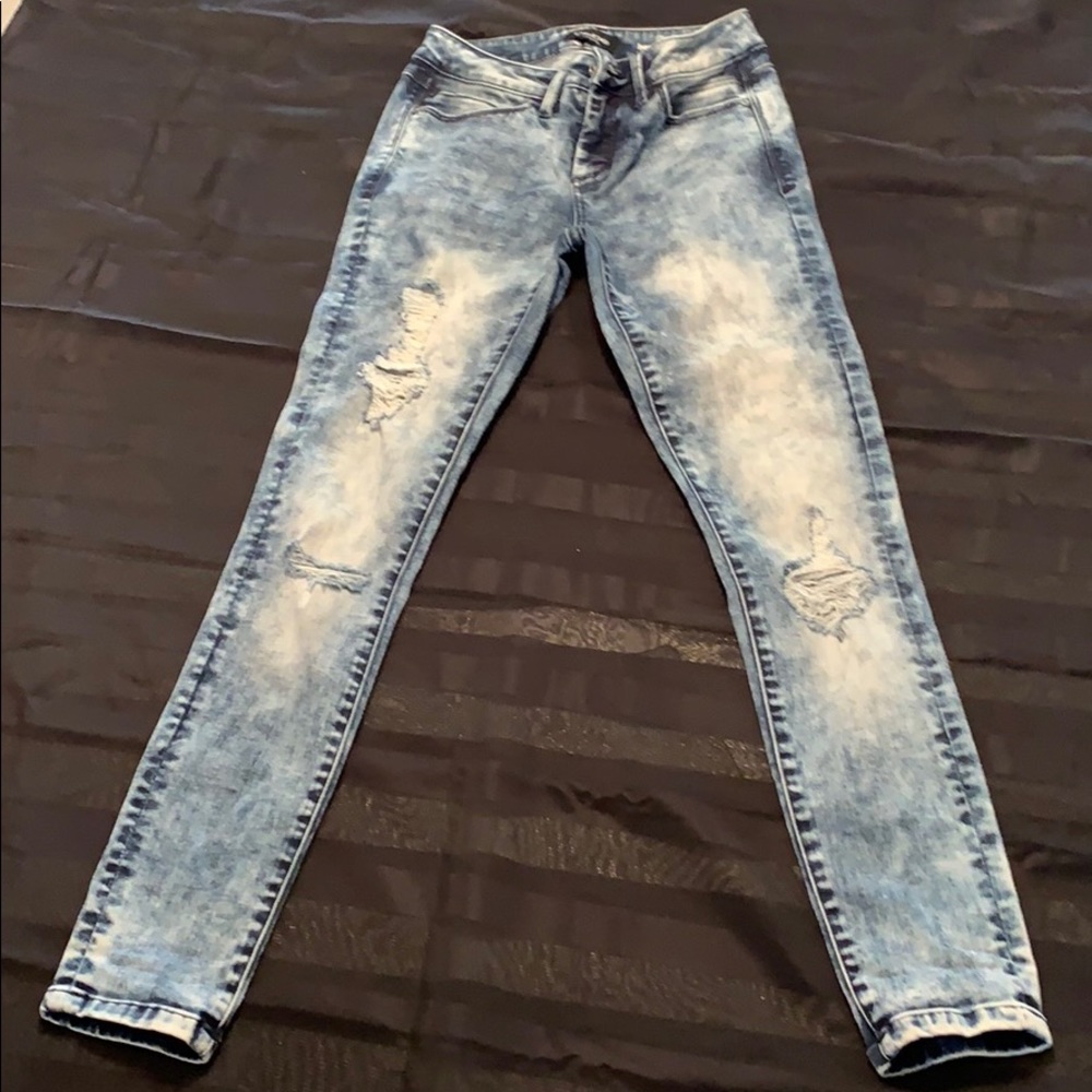 Bebe Distressed skinny jeans